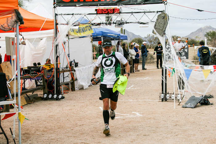 HCM, a jersey-sponsor nonprofit for which Agnew (at the start-finish line of the Javelina 100) raised money, parted ways with the runner in 2012, around the time he moved to Utah.